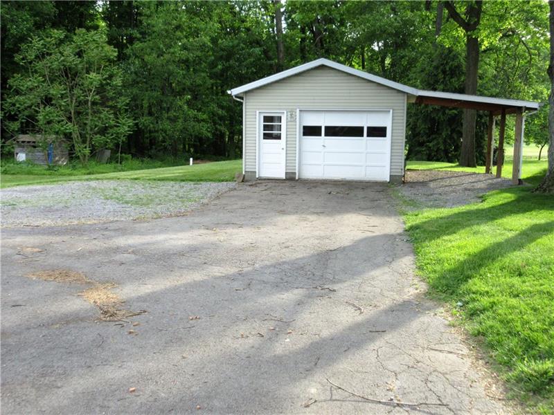 724 North Pike Road Cabot, PA 16023 - Photo 20 of 25 The 1 car garage has been insulated, has new 60 amp electric, and has a new roof and carport.
