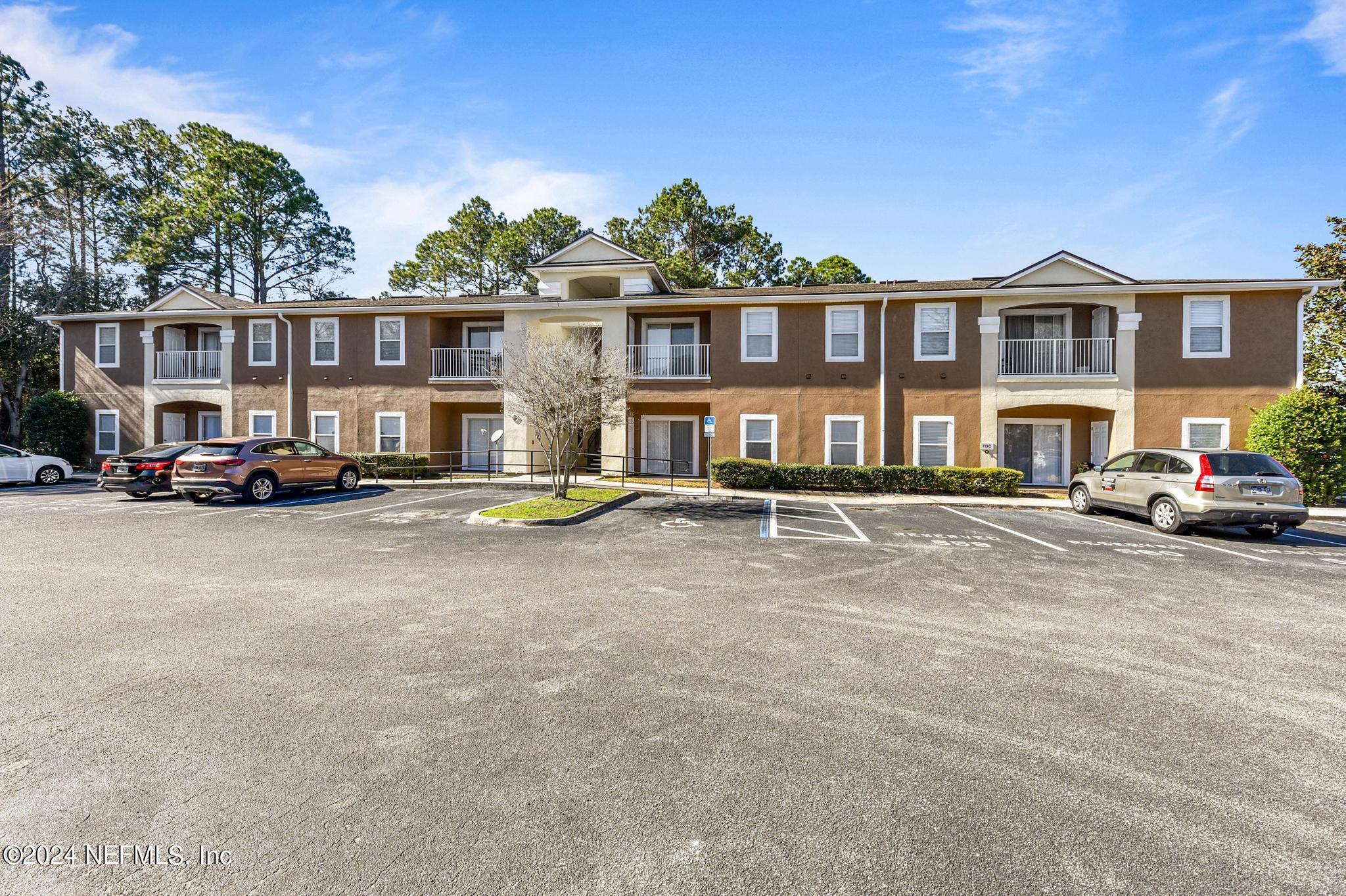 7920 Merrill Road, Unit 2205 Jacksonville, FL 32277 - Photo 1 of 21 a view of multiple houses with a street