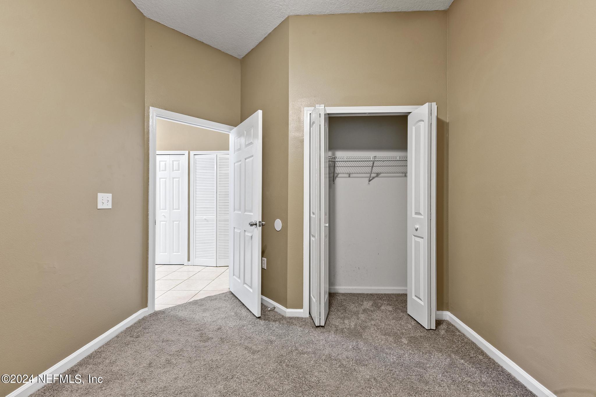 7920 Merrill Road, Unit 2205 Jacksonville, FL 32277 - Photo 14 of 21 a view of an empty room and closet