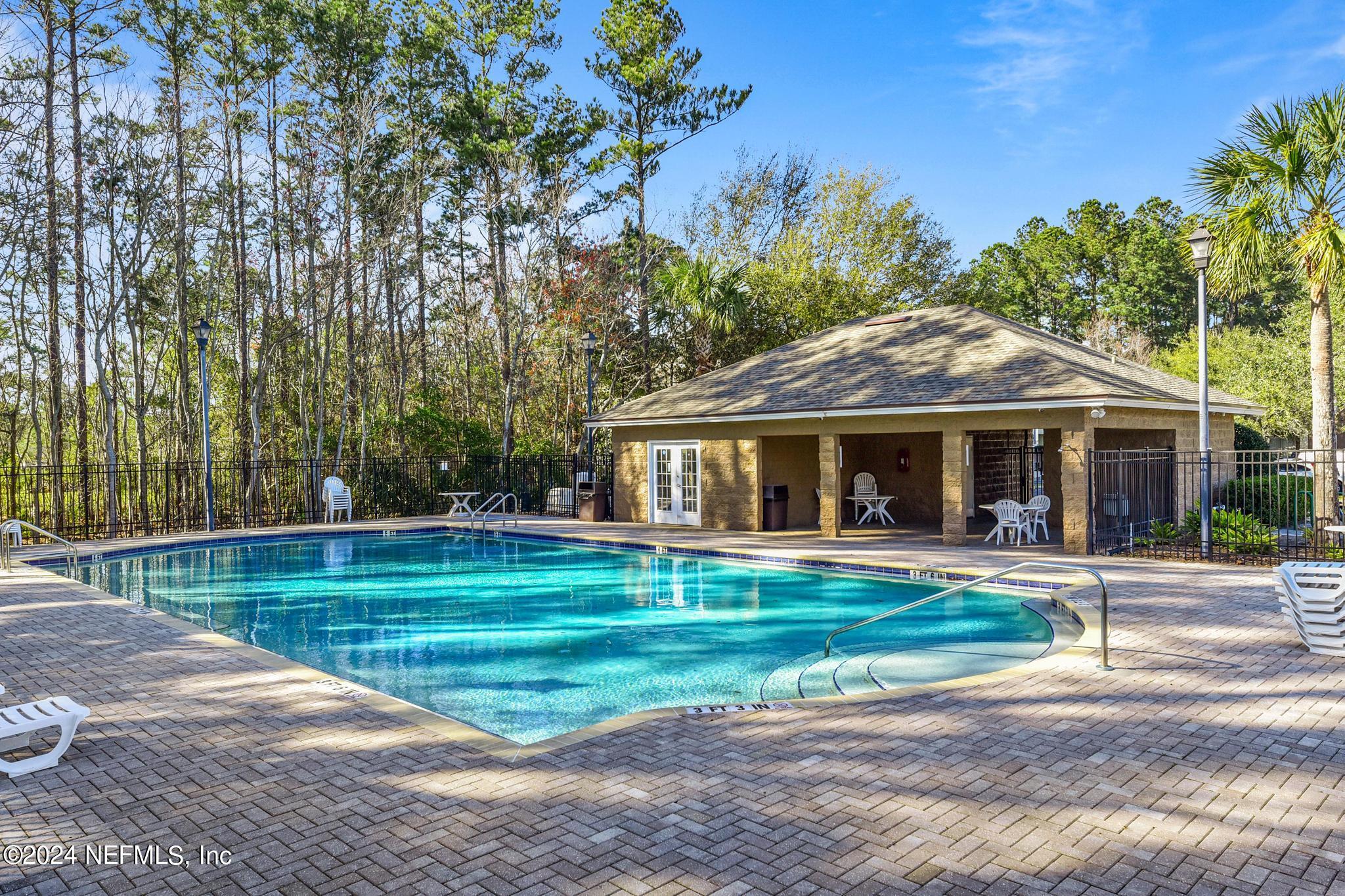7920 Merrill Road, Unit 2205 Jacksonville, FL 32277 - Photo 19 of 21 a front view of a house with a yard
