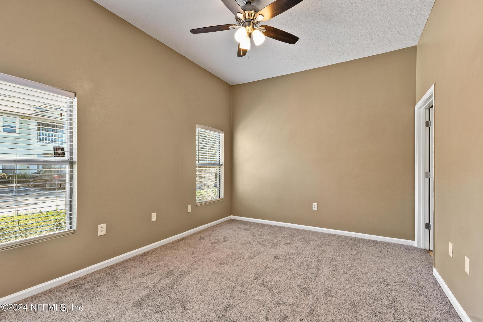 7920 Merrill Road, Unit 2205 Jacksonville, FL 32277 - Photo 9 of 21 a view of an empty room with a window