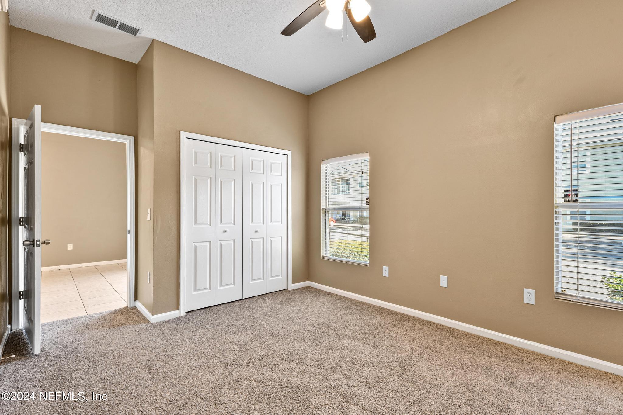 7920 Merrill Road, Unit 2205 Jacksonville, FL 32277 - Photo 10 of 21 a view of an empty room with a window