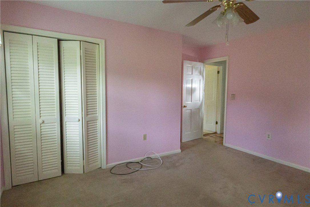 309 Old Plank Road Kenbridge, VA 23944 - Photo 29 of 45 Louvered bifold closet doors with white trim, ceil