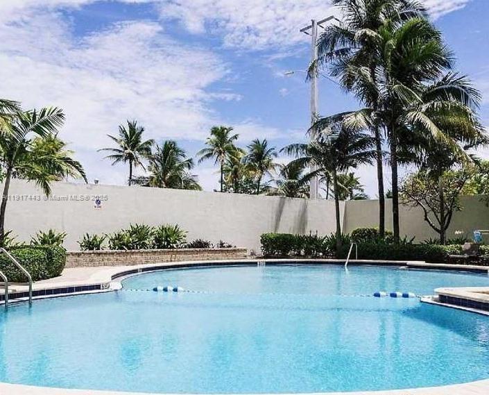 4001 South Ocean Drive, Unit 7F Hollywood, FL 33019 - Photo 14 of 20 a front view of a house with swimming pool