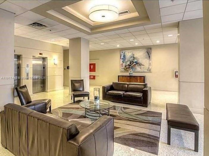 4001 South Ocean Drive, Unit 7F Hollywood, FL 33019 - Photo 17 of 20 a living room with furniture and a fireplace