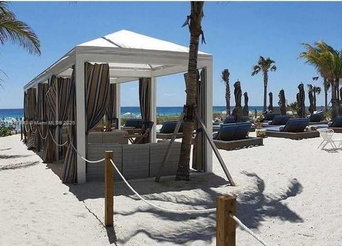 4001 South Ocean Drive, Unit 7F Hollywood, FL 33019 - Photo 19 of 20 a view of a patio with furniture and floor to ceiling windows