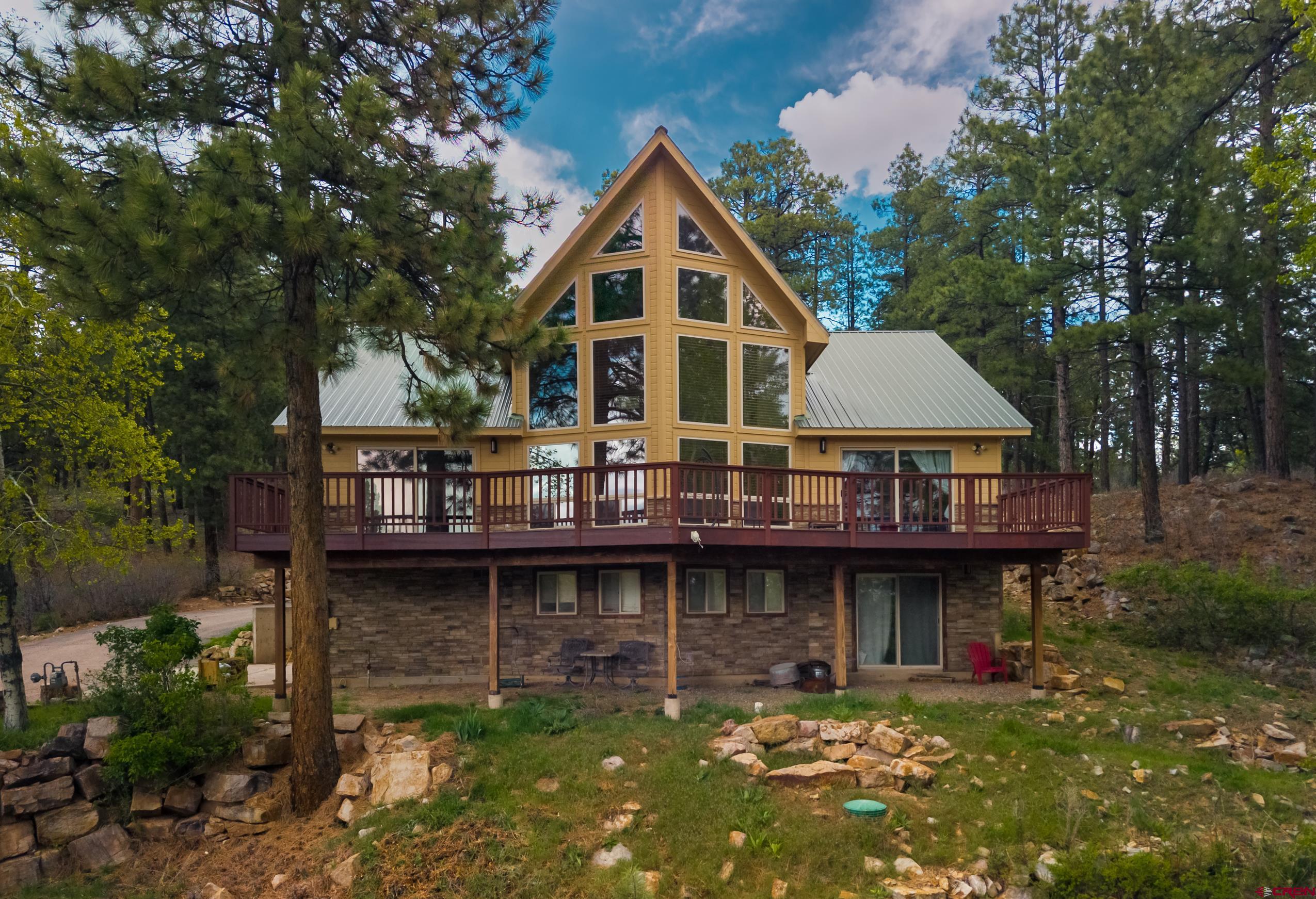 197 Buckhorn Road Bayfield, CO 81122 - Photo 1 of 34 a front view of house with yard and trees around