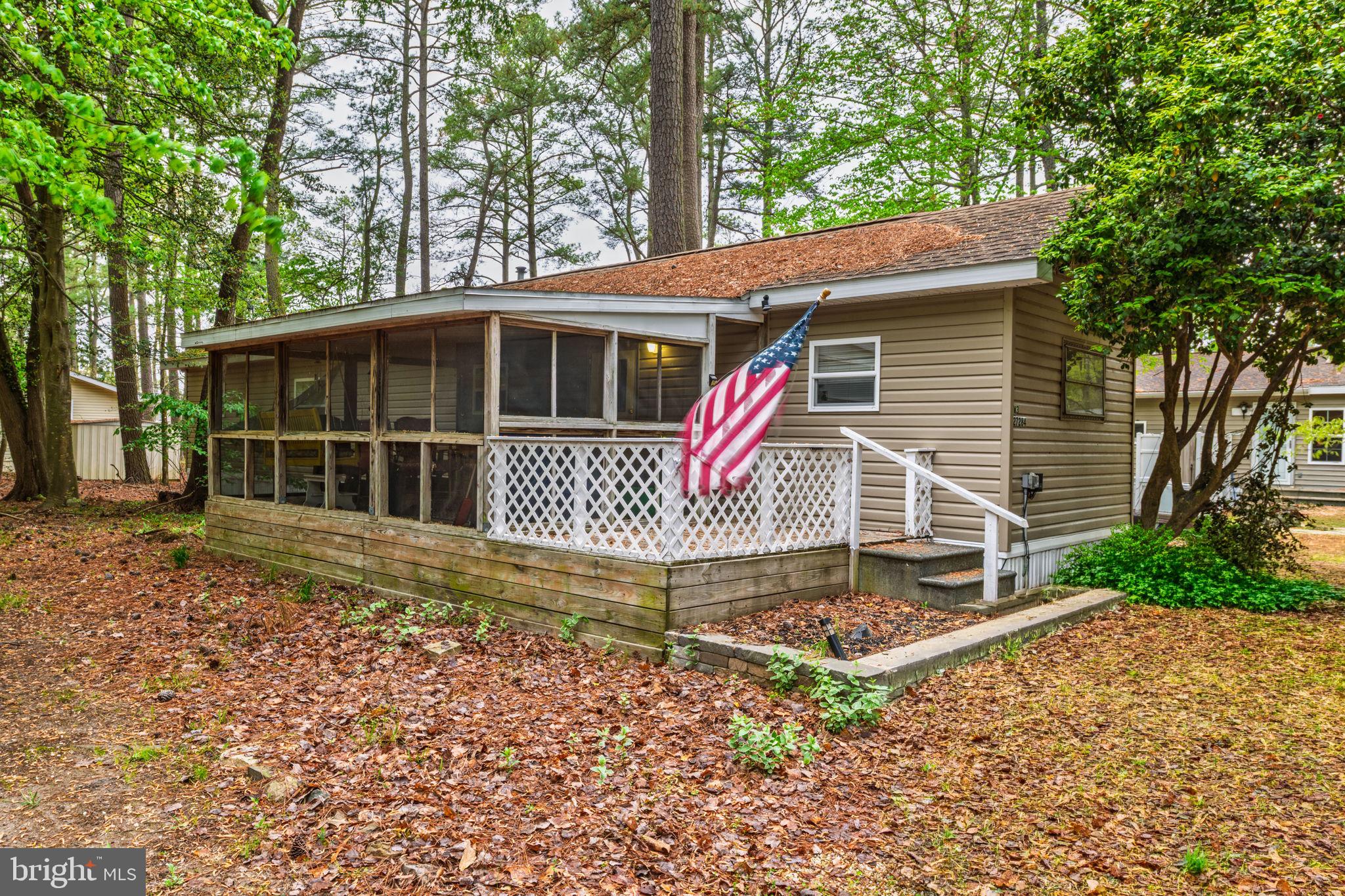 27284 Cottage Road, Unit 9182 Millsboro, DE 19966 - Photo 1 of 18 a view of a house with a yard