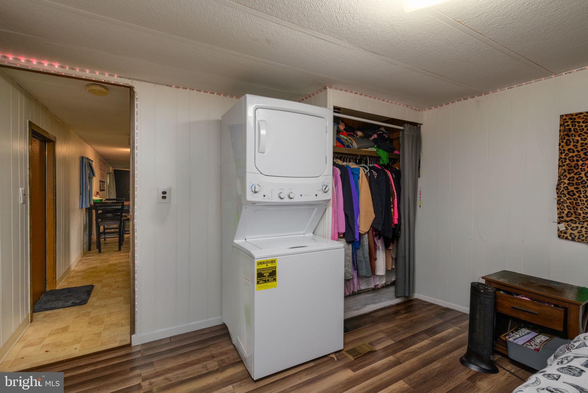 27284 Cottage Road, Unit 9182 Millsboro, DE 19966 - Photo 15 of 18 a view of walk in closet with clothes and shoes