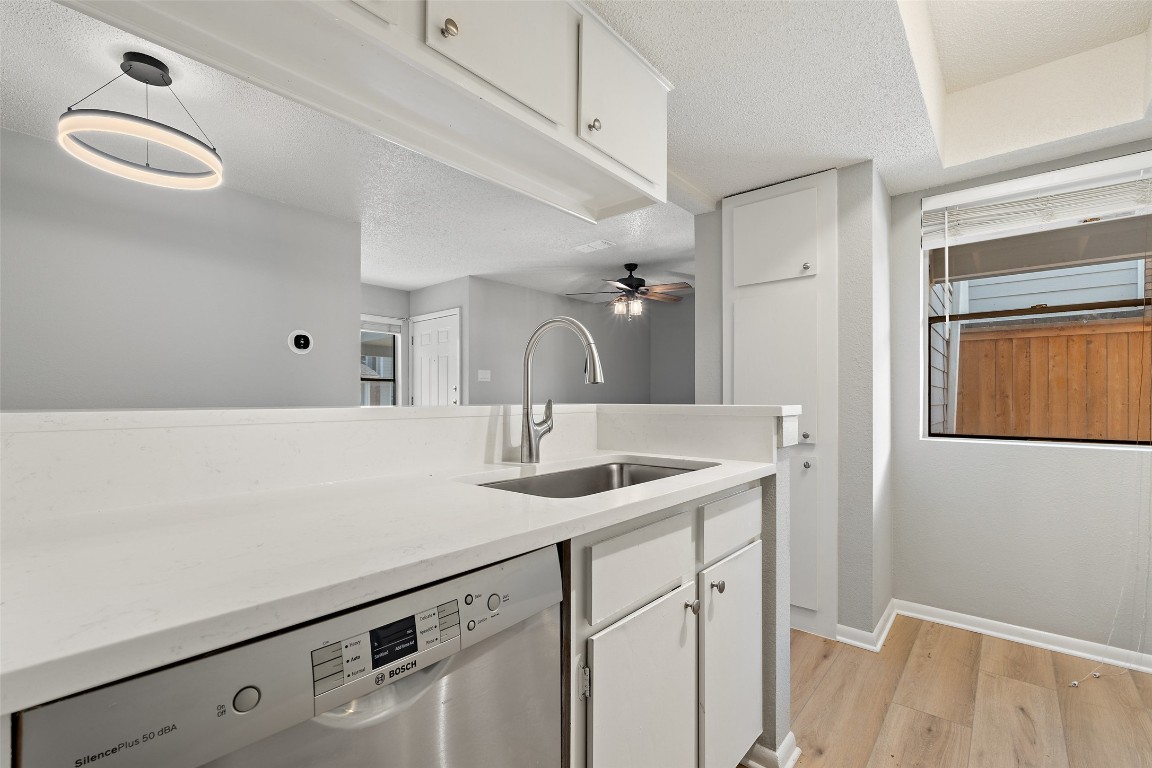 7635 Guadalupe Street, Unit 102 Austin, TX 78752 - Photo 11 of 36 a bathroom with a sink and a mirror