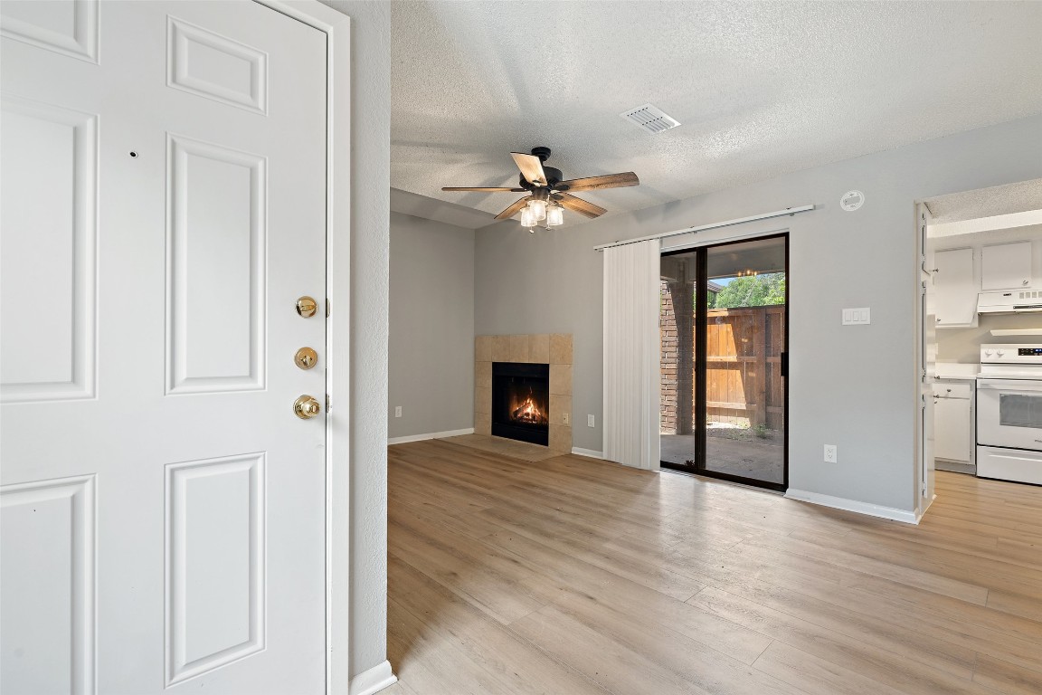 7635 Guadalupe Street, Unit 102 Austin, TX 78752 - Photo 12 of 36 a view of a livingroom with a fireplace