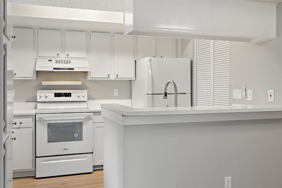 7635 Guadalupe Street, Unit 102 Austin, TX 78752 - Photo 17 of 36 a kitchen with appliances cabinets and a sink