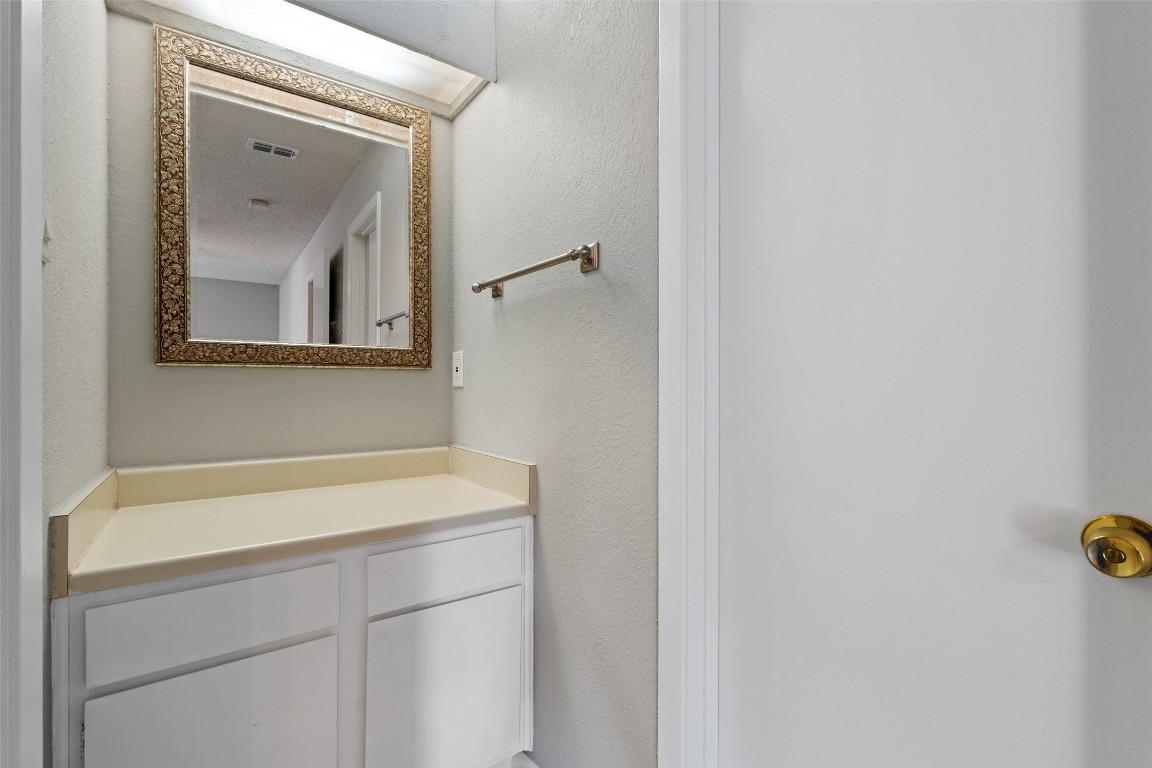 7635 Guadalupe Street, Unit 102 Austin, TX 78752 - Photo 23 of 36 a bathroom with a sink and a mirror