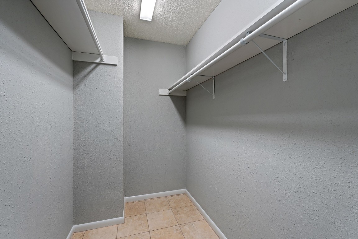 7635 Guadalupe Street, Unit 102 Austin, TX 78752 - Photo 24 of 36 a view of an empty walk in closet