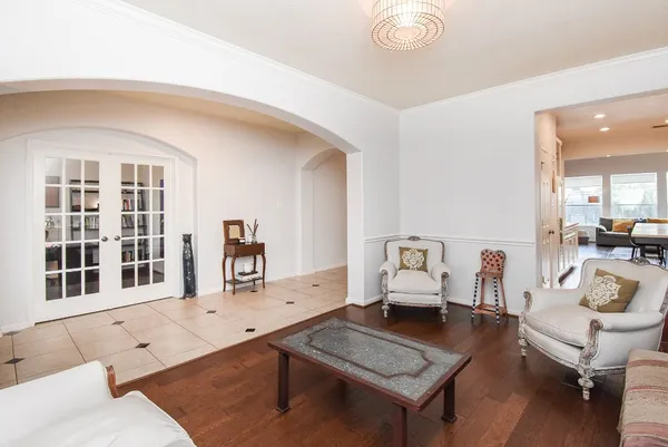 a living room with furniture and next to a window
