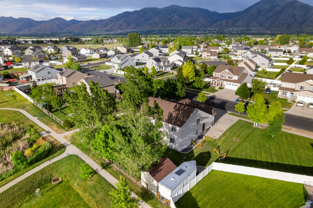 2485 South 1100th Street West Logan, UT 84321 - Photo 43 of 53 Residential neighborhood featuring a paved pathway system, mature trees, and mountain backdrop