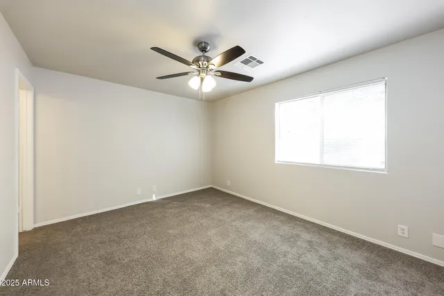 a kitchen with a sink stove top oven and cabinets
