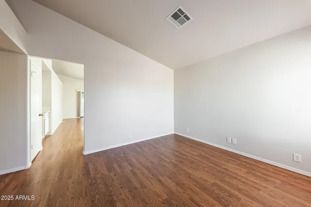 a bathroom with a sink a toilet and a large mirror