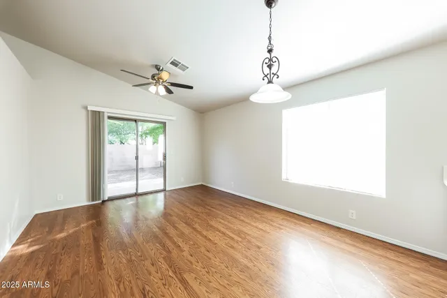 a view of kitchen with stove and wooden floor