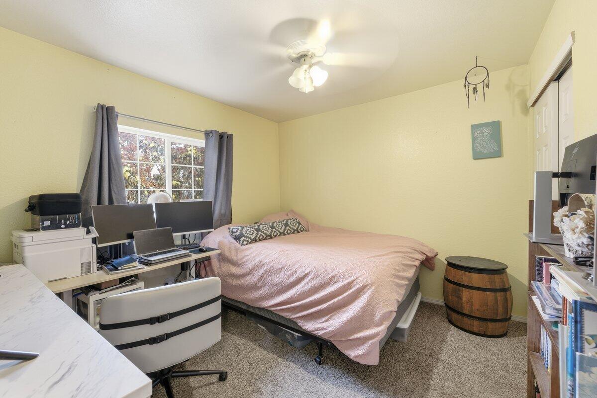 650 Sarah Lane Eagle Point, OR 97524 - Photo 15 of 19 a bedroom with a bed and a window