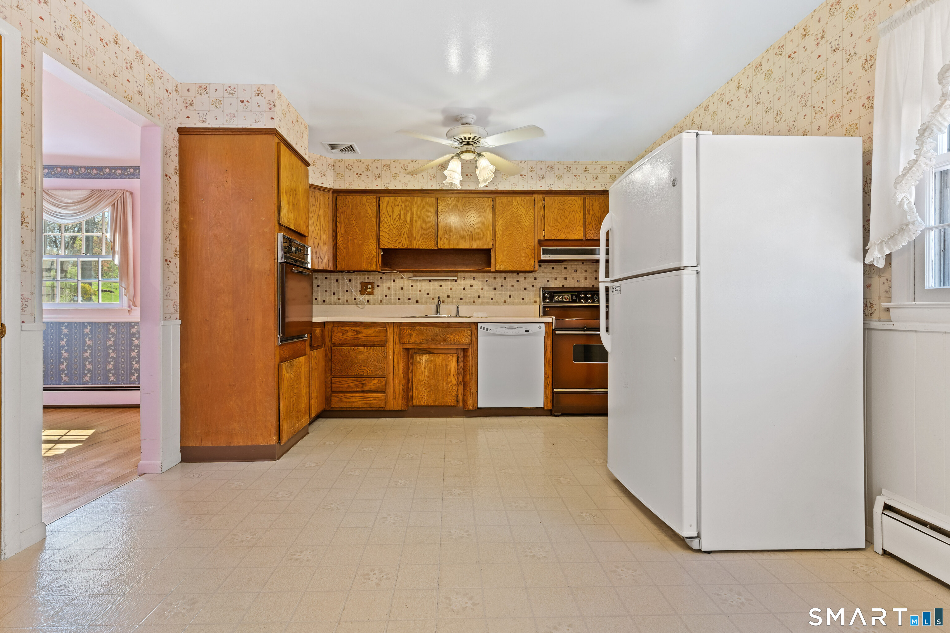 251 Shelter Rock Road Fairfield, CT 06825 - Photo 14 of 38 a kitchen with stainless steel appliances granite countertop a refrigerator a oven a sink and dishwasher