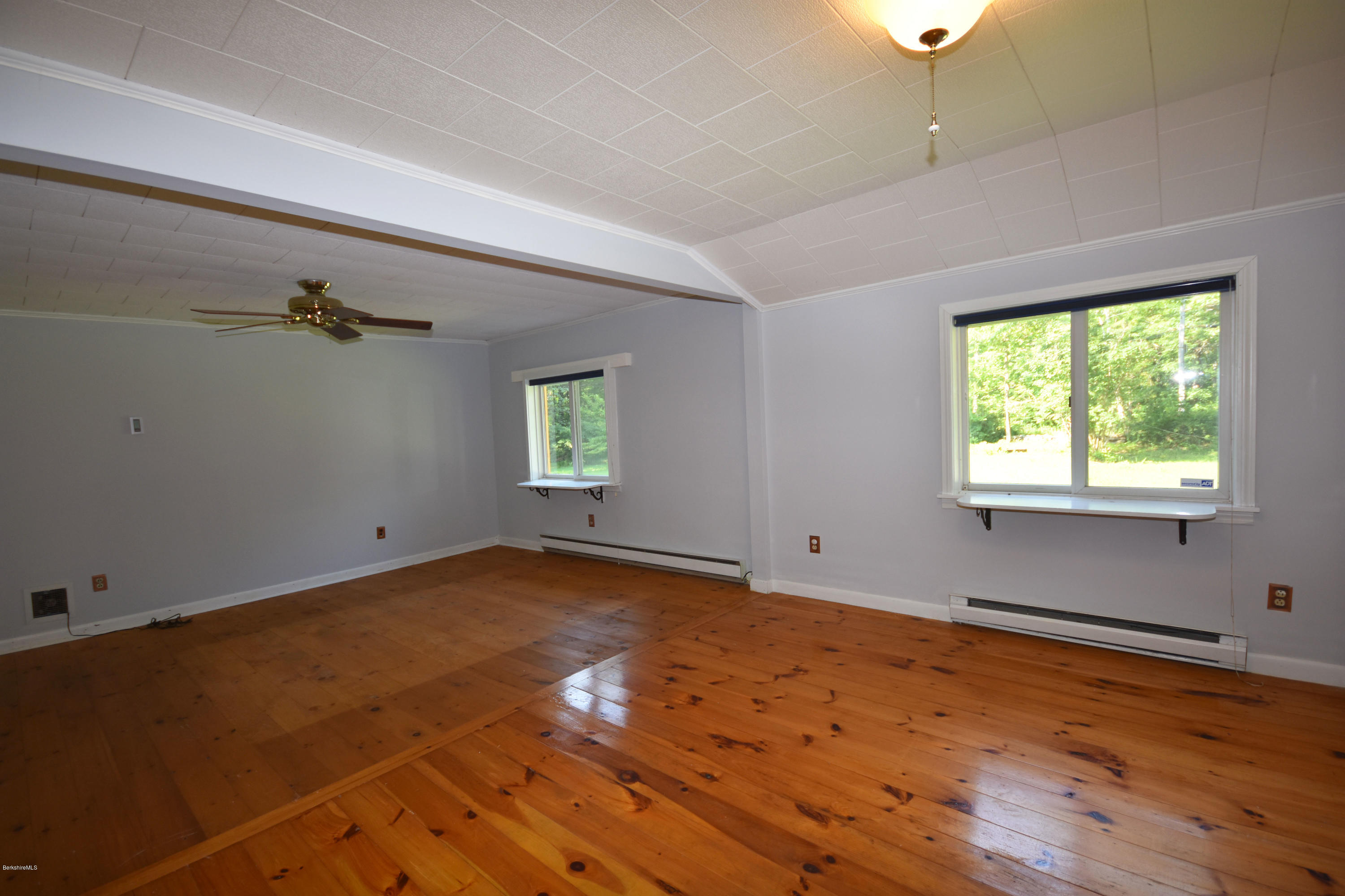 834 George Carter Road Becket, MA 01223 - Photo 28 of 61 an empty room with a empty space and windows