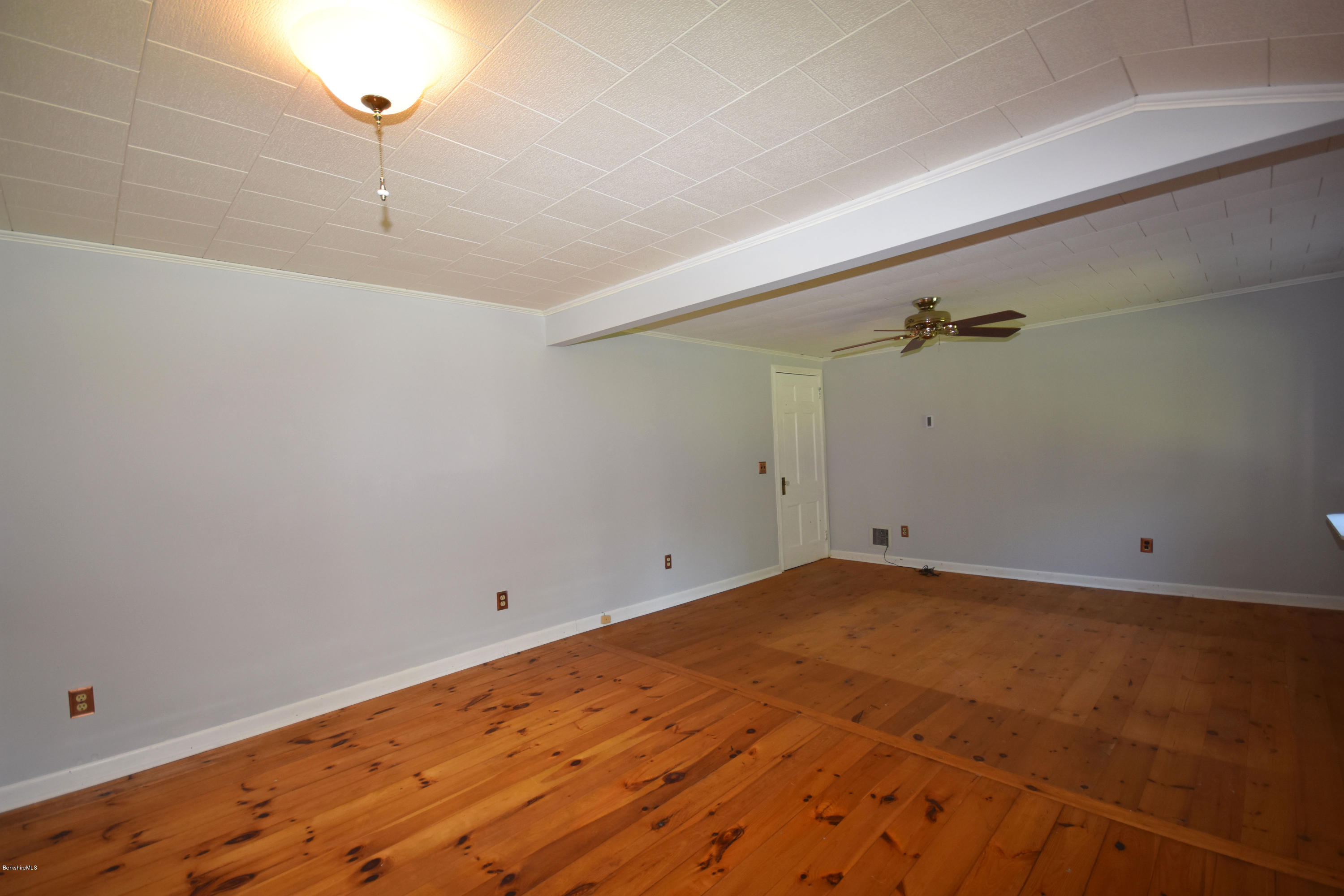 834 George Carter Road Becket, MA 01223 - Photo 29 of 61 a view of a room with closet and wooden floor