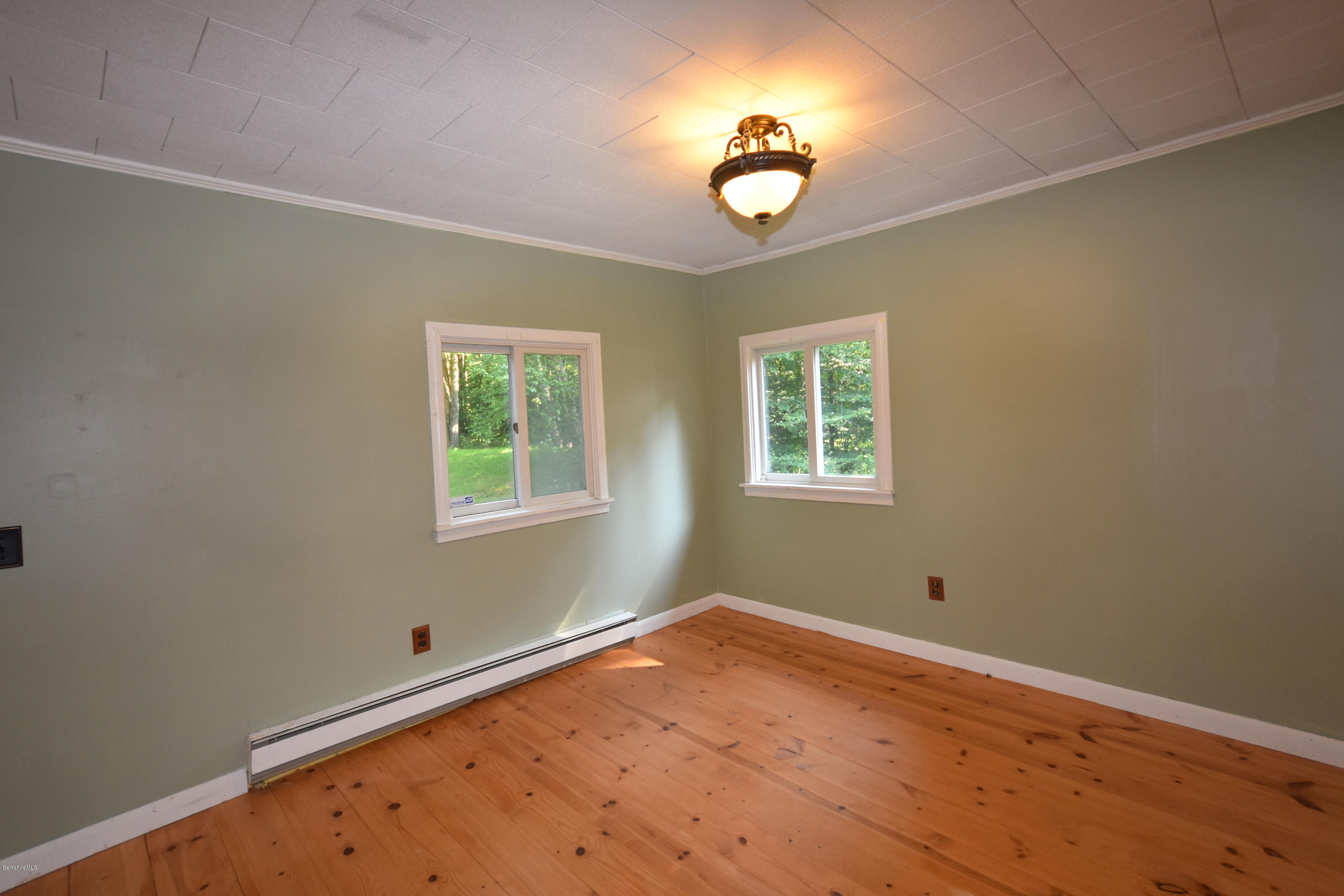 834 George Carter Road Becket, MA 01223 - Photo 30 of 61 an empty room with a window