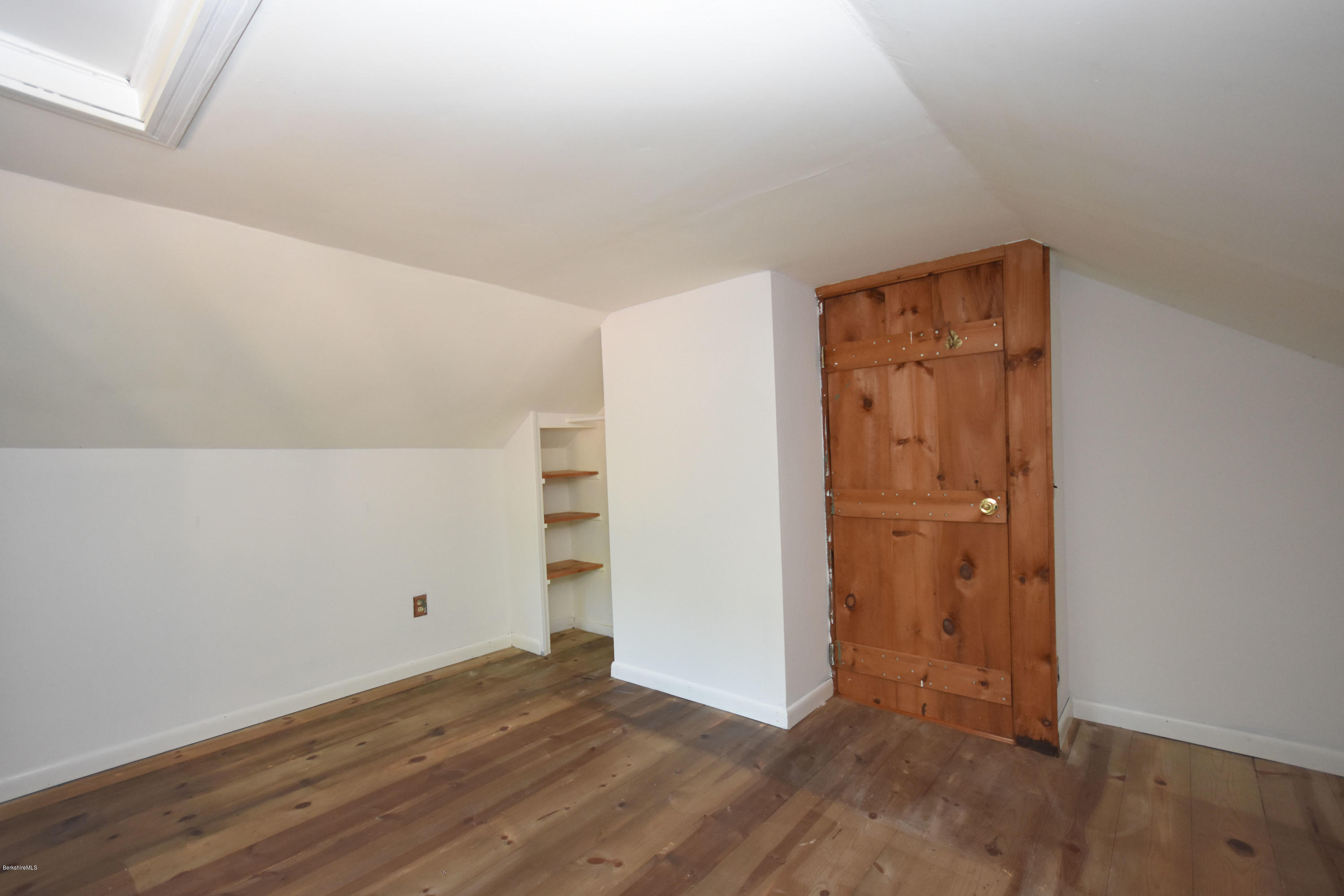 834 George Carter Road Becket, MA 01223 - Photo 43 of 61 an empty room with wooden floor and closet