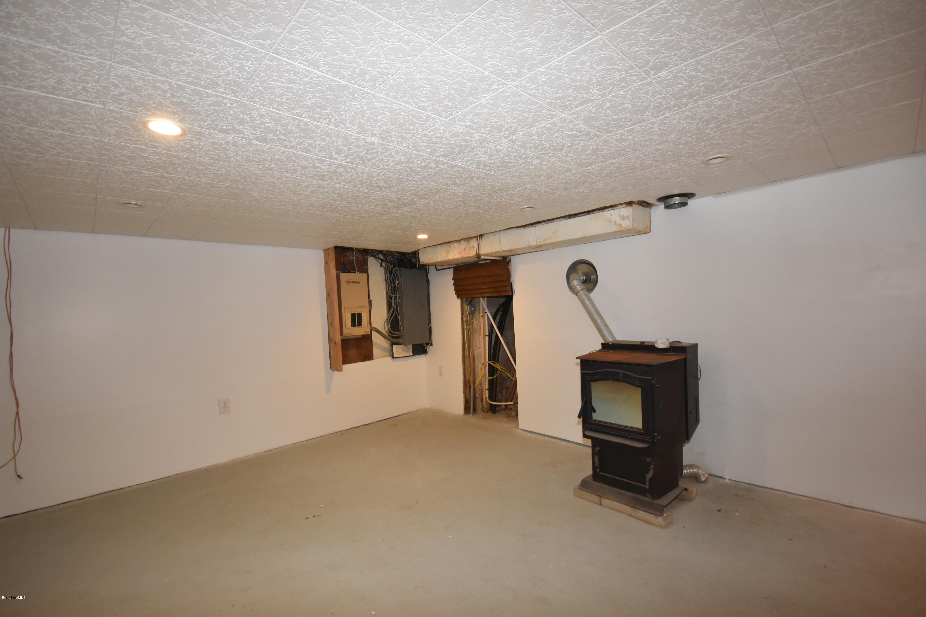834 George Carter Road Becket, MA 01223 - Photo 47 of 61 a room with furniture and a window