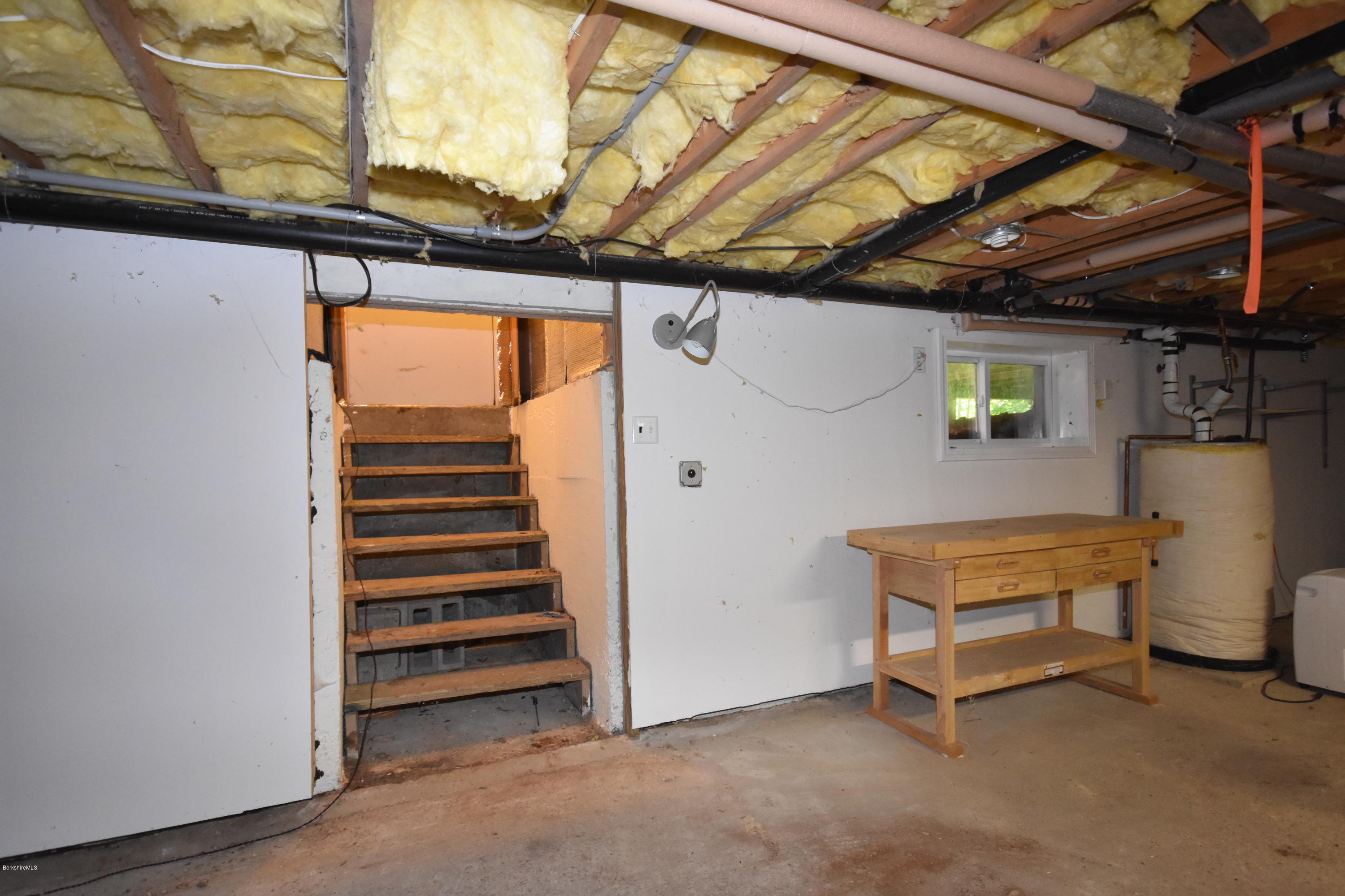 834 George Carter Road Becket, MA 01223 - Photo 49 of 61 a view of a room with racks on the wall