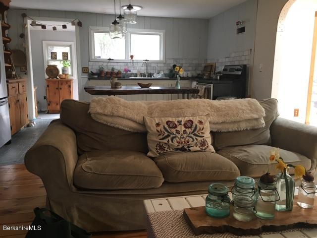 834 George Carter Road Becket, MA 01223 - Photo 7 of 61 a living room with furniture and a large window