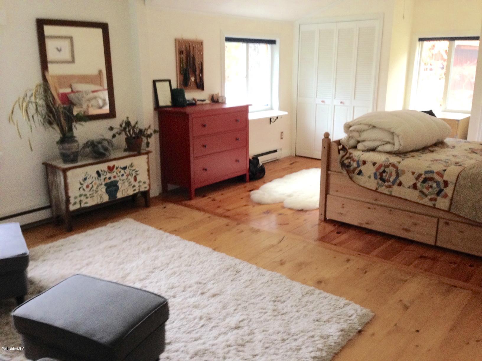 834 George Carter Road Becket, MA 01223 - Photo 10 of 61 a bedroom with a bed and a dresser