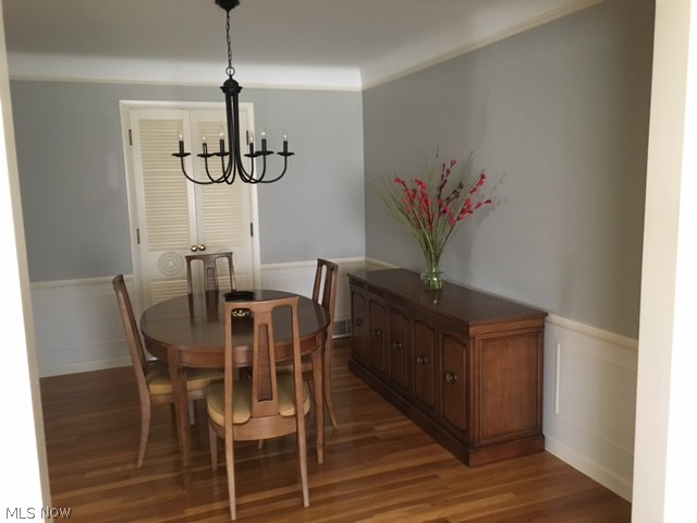 1240 Brainard Road Lyndhurst, OH 44124 - Photo 9 of 12 Recently updated dining room with freshly painted walls after wallpaper removal. The new light fixture adds a contemporary flair to the space. Gleaming hardwood floors throughout most of the home. The French doors open up to the vaulted family room with fireplace.