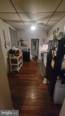 a kitchen with a stove and a refrigerator