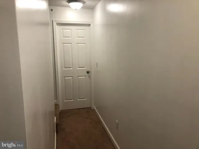 a bedroom with a bed and dresser