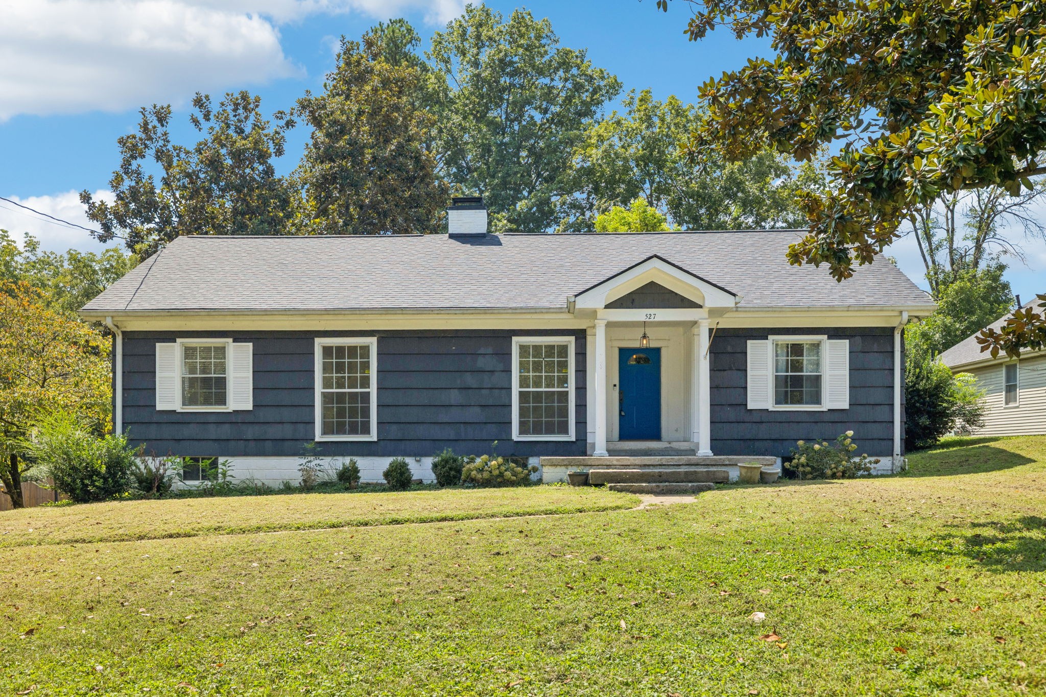 a front view of a house with a yard