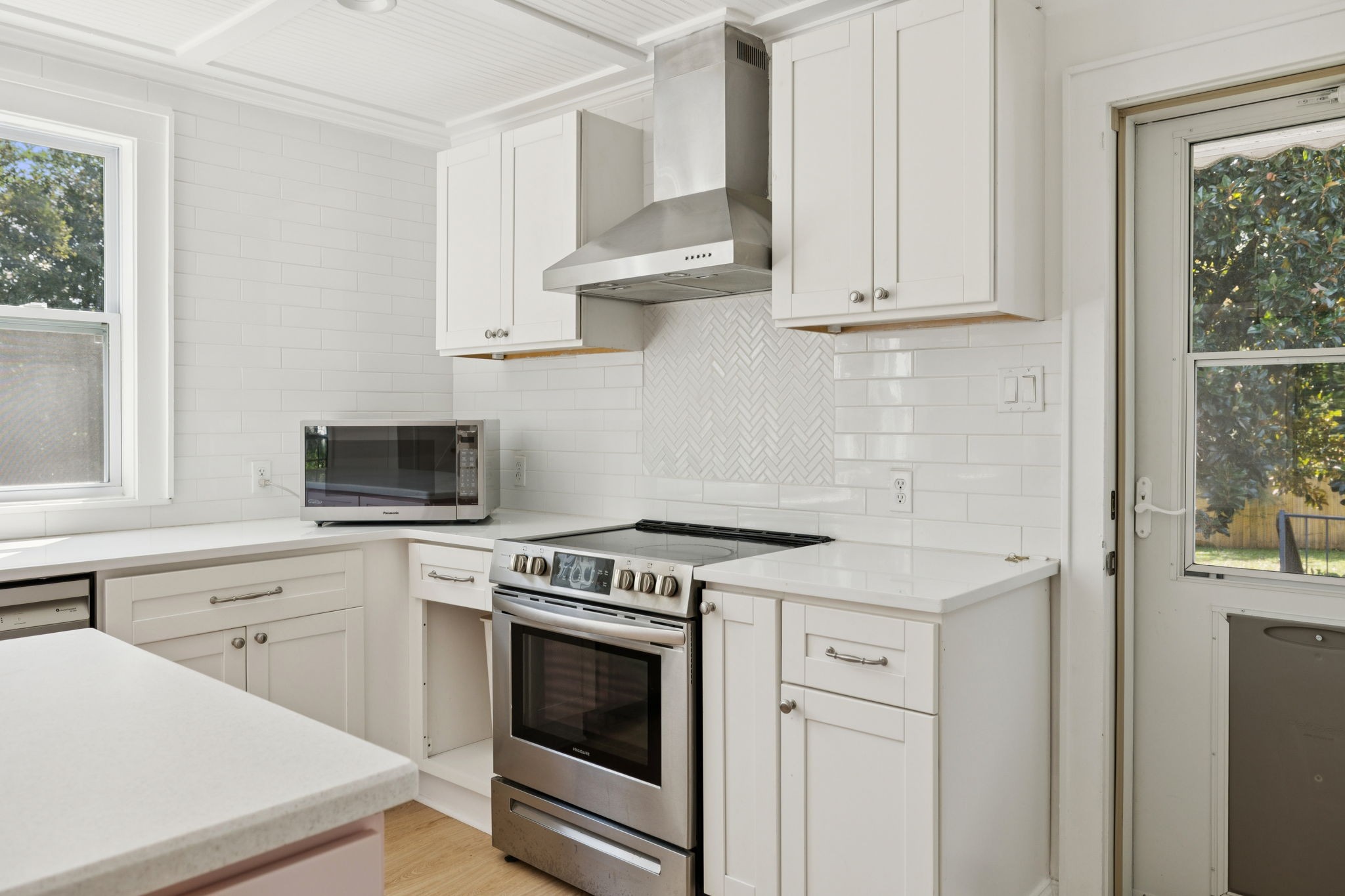 527 East Madison Street Pulaski, TN 38478 - Photo 14 of 74 a kitchen with white cabinets and white appliances