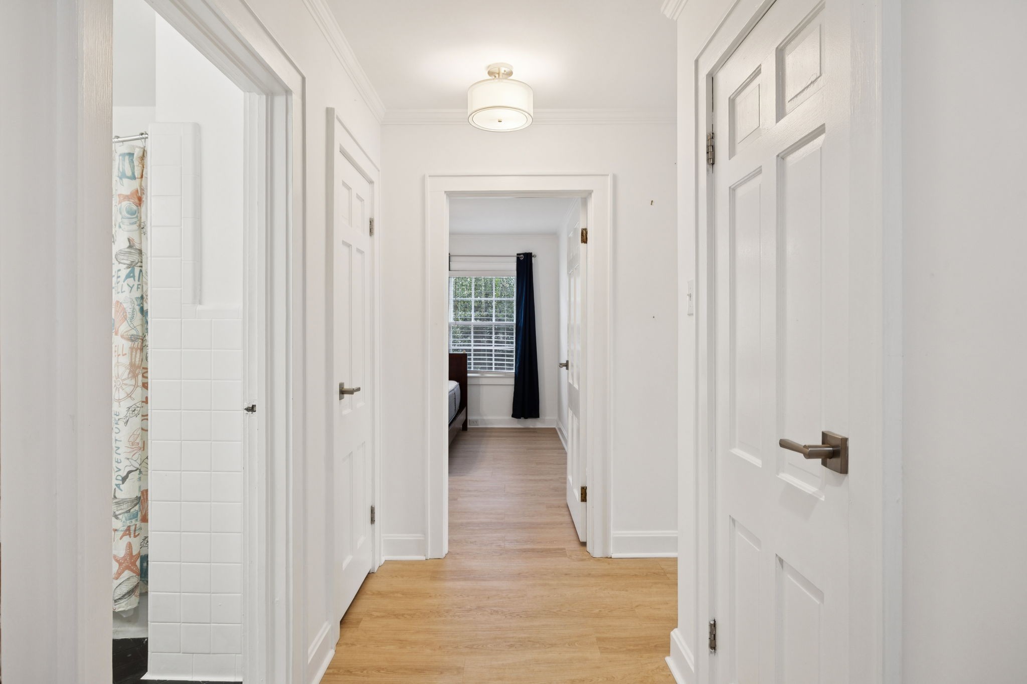 527 East Madison Street Pulaski, TN 38478 - Photo 46 of 74 a view of a hallway with wooden floor and closet area