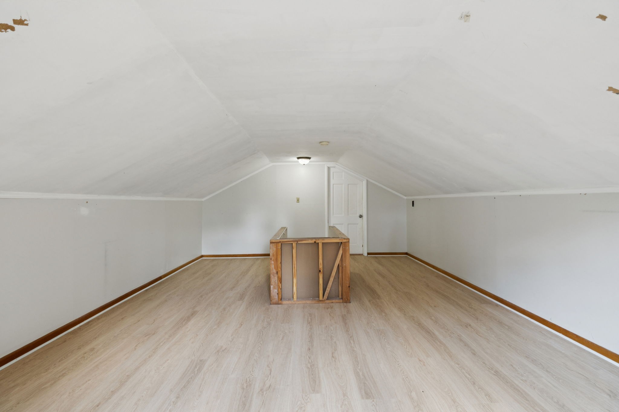 527 East Madison Street Pulaski, TN 38478 - Photo 52 of 74 a view of an empty room with wooden floor