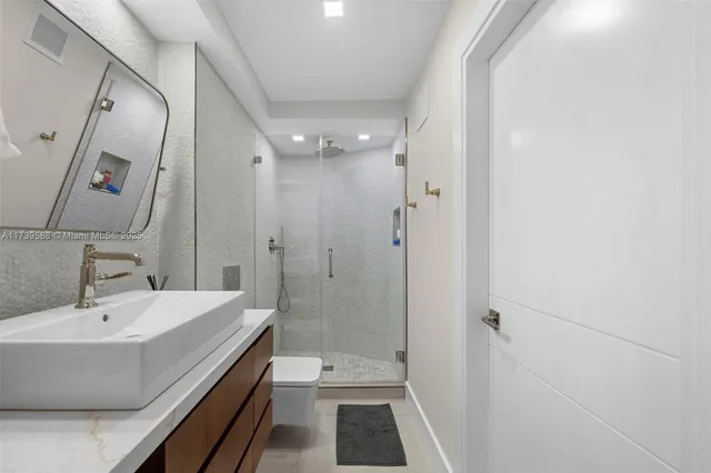 a bathroom with a bathtub and a sink