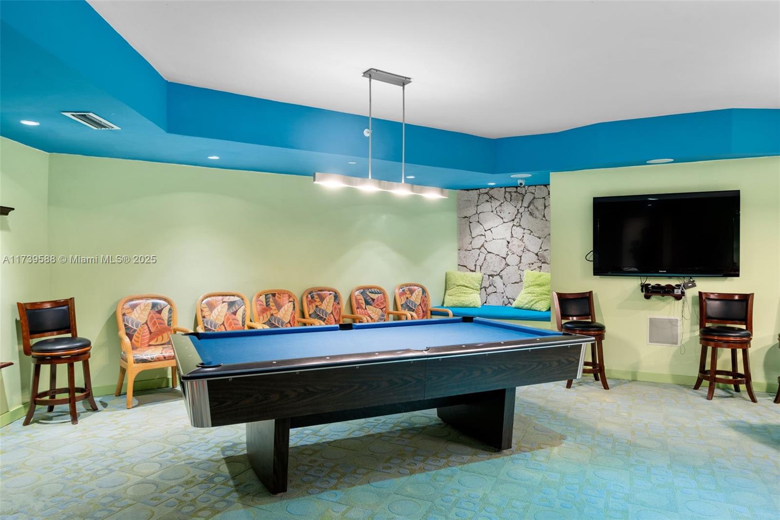 1121 Crandon Boulevard, Unit E503 Key Biscayne, FL 33149 - Photo 19 of 29 a room with furniture pool table and flat screen tv