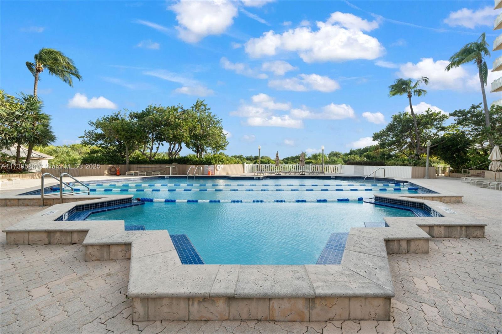 1121 Crandon Boulevard, Unit E503 Key Biscayne, FL 33149 - Photo 22 of 29 a view of a lake with a terrace