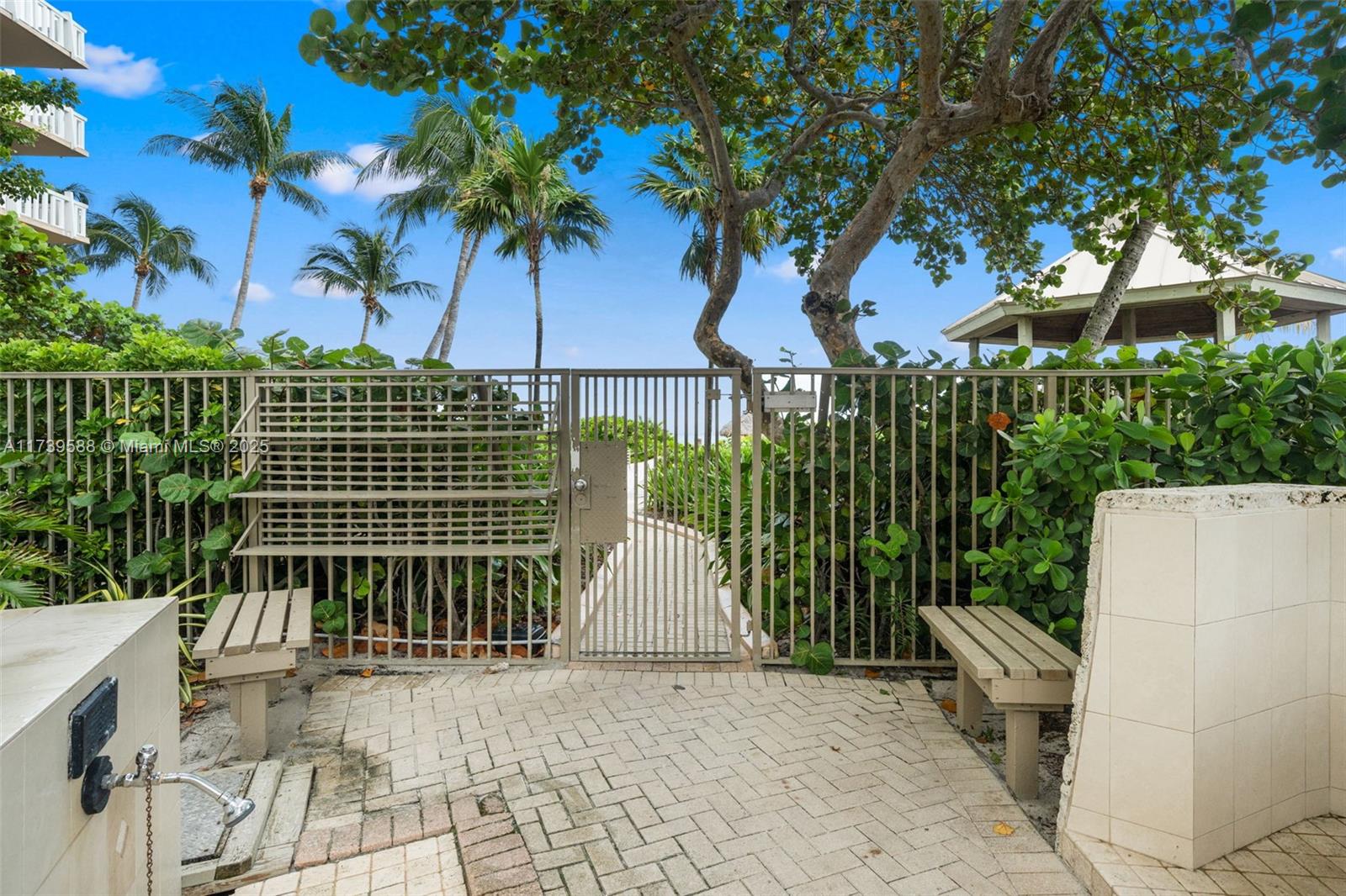 1121 Crandon Boulevard, Unit E503 Key Biscayne, FL 33149 - Photo 24 of 29 a view of a house with a garden
