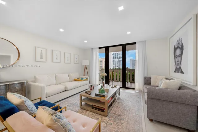 a living room with furniture and large window