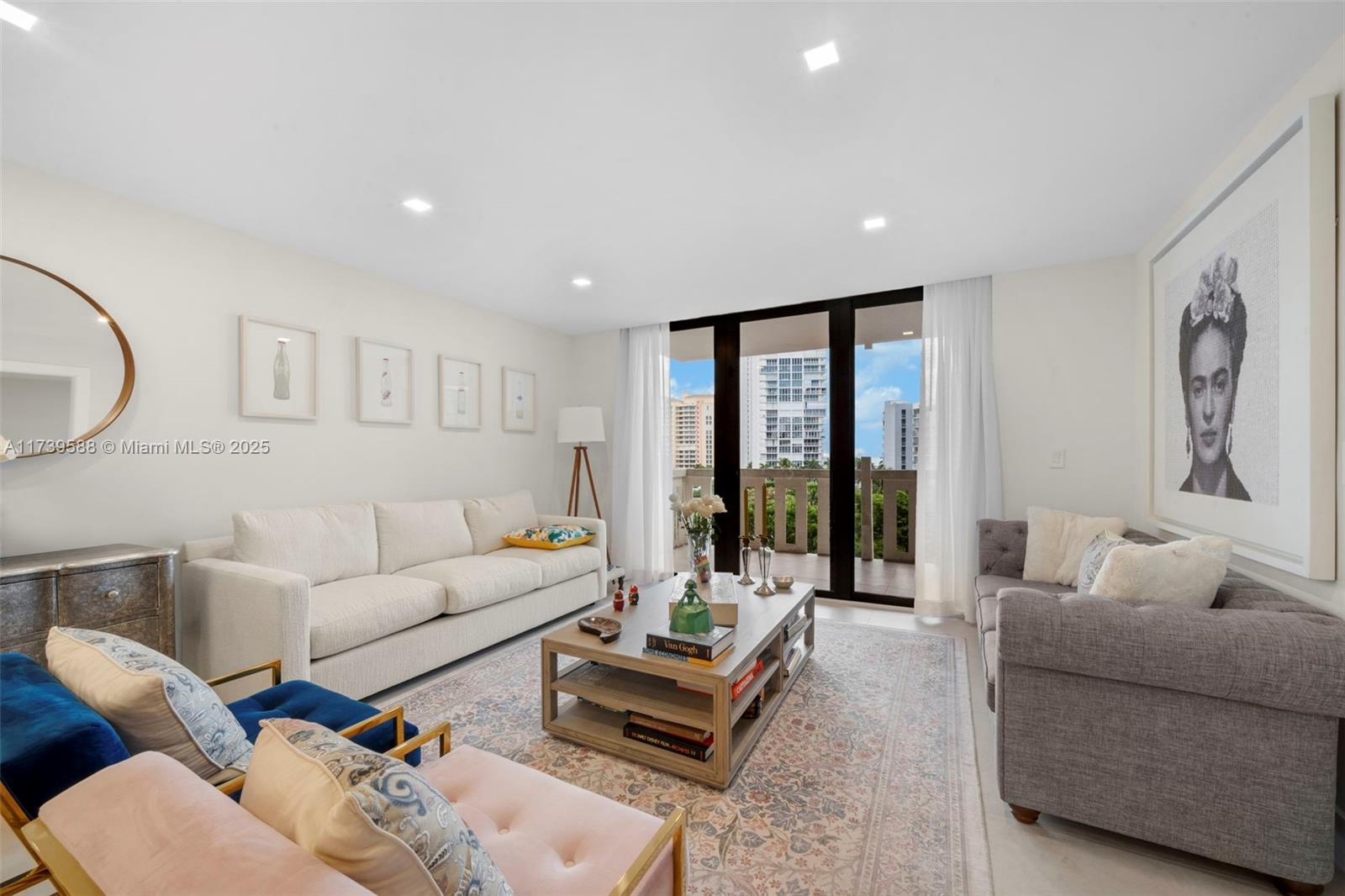 1121 Crandon Boulevard, Unit E503 Key Biscayne, FL 33149 - Photo 3 of 29 a living room with furniture and large window