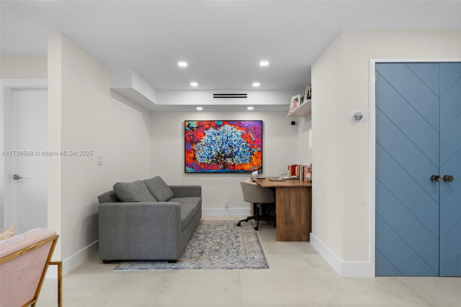 1121 Crandon Boulevard, Unit E503 Key Biscayne, FL 33149 - Photo 6 of 29 a living room with furniture and a flat screen tv