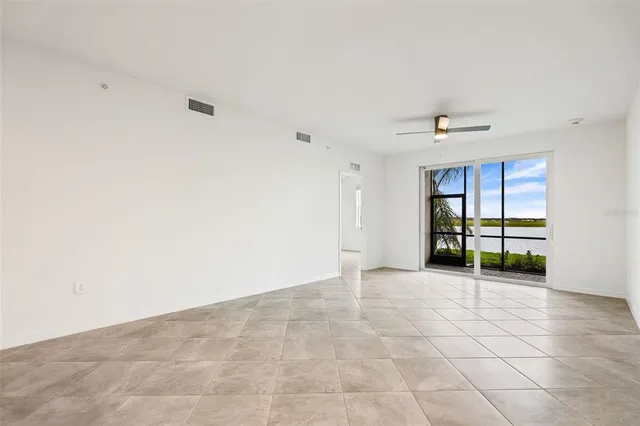 a view of an empty room with a window