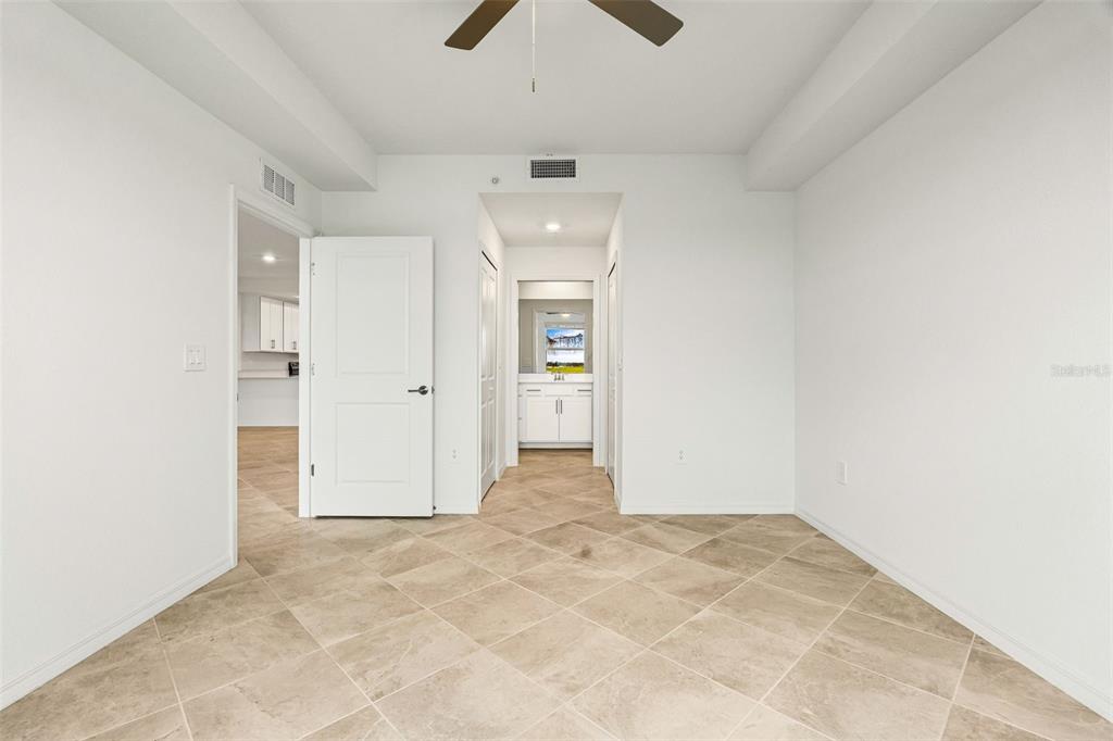 19140 Scallop Loop, Unit 105 Lakewood Ranch, FL 34211 - Photo 17 of 37 an empty room with closet and windows