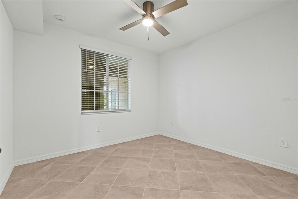 19140 Scallop Loop, Unit 105 Lakewood Ranch, FL 34211 - Photo 22 of 37 an empty room with windows and fan